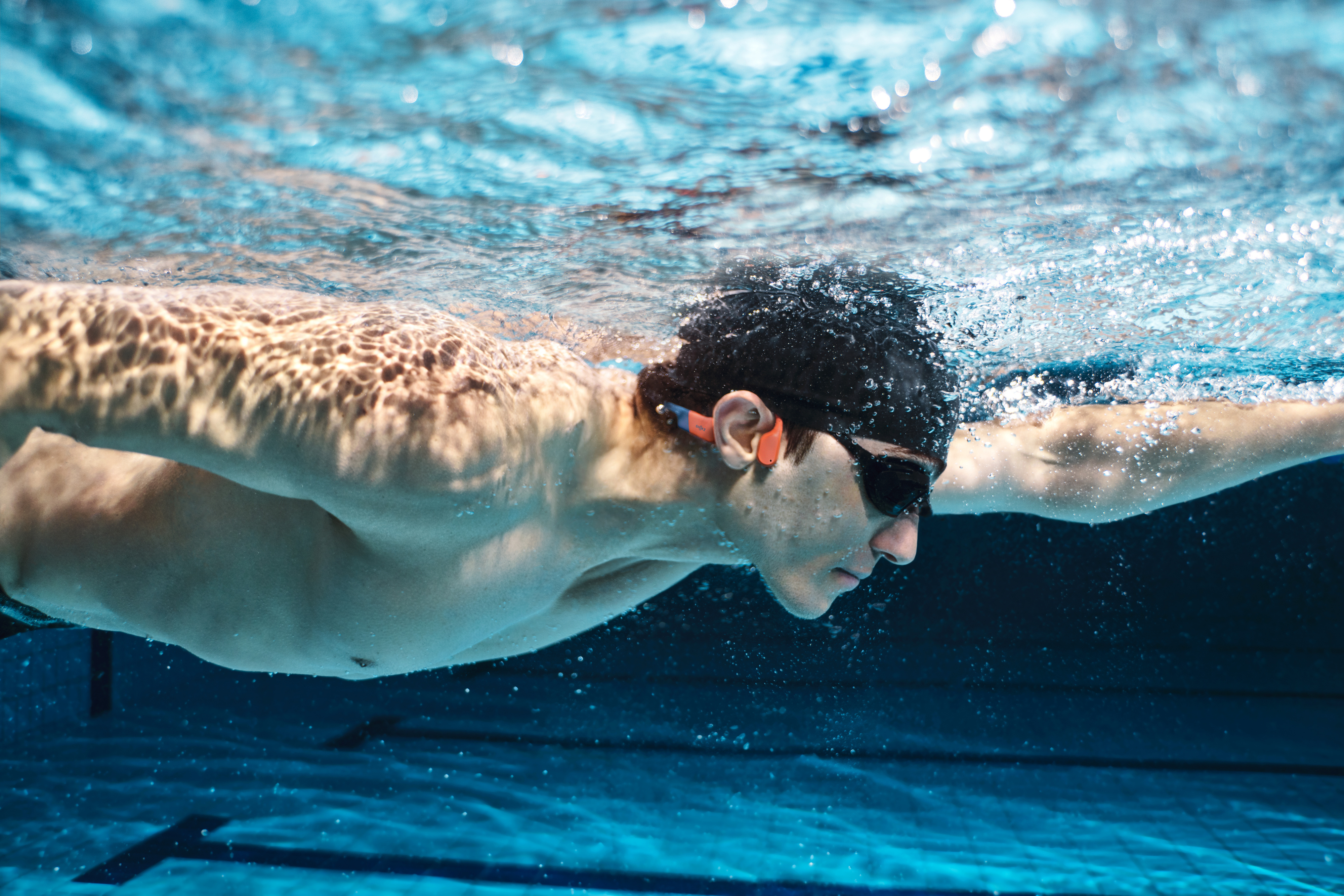 Shokz Openswim Pro luujohdekuulokkeet, harmaa